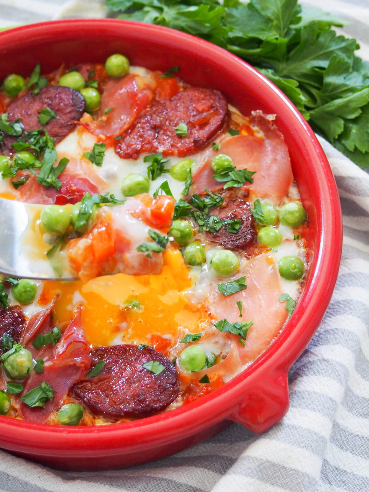fork held over dish of flamenco eggs