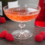 glass of kir imperial raspberry champagne cocktail