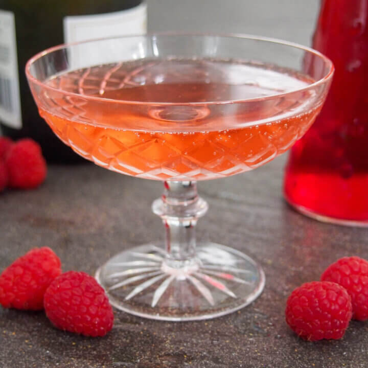glass of kir imperial raspberry champagne cocktail