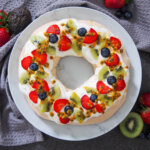 pavlova wreath topped with fruit from overhead