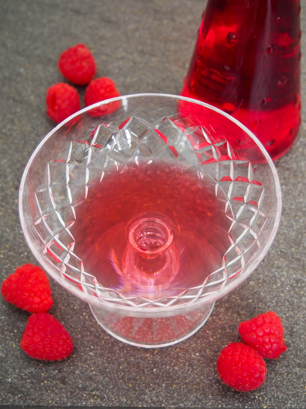 raspberry liqueur in bottom of glass
