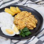 Aji de gallina (Peruvian chicken stew) with rice and potato