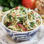 bowl of apple celeriac salad with bacon