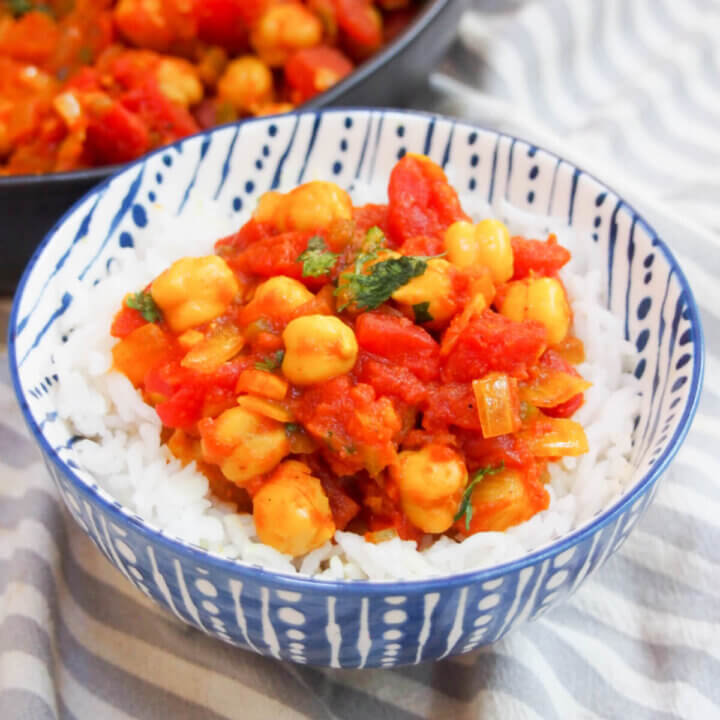 bowl of chana masala served over rice