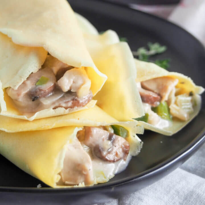 Chicken crepes with leek and mushrooms on plate