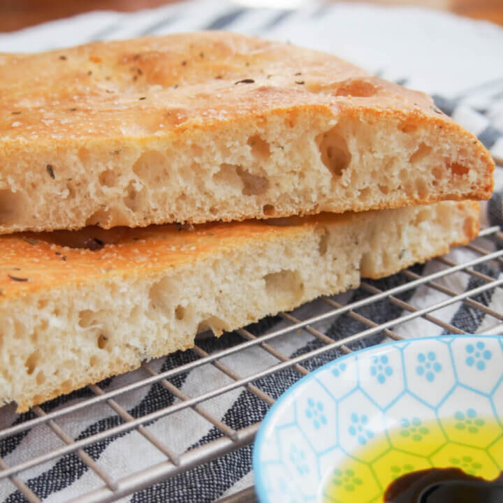 cut pieces of lemon thyme focaccia stacked on top of each other
