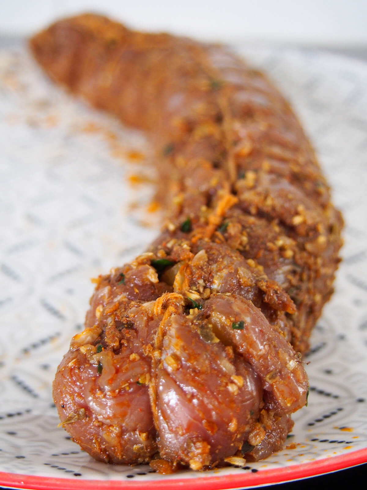 marinated, rolled and tied pork ready to cook