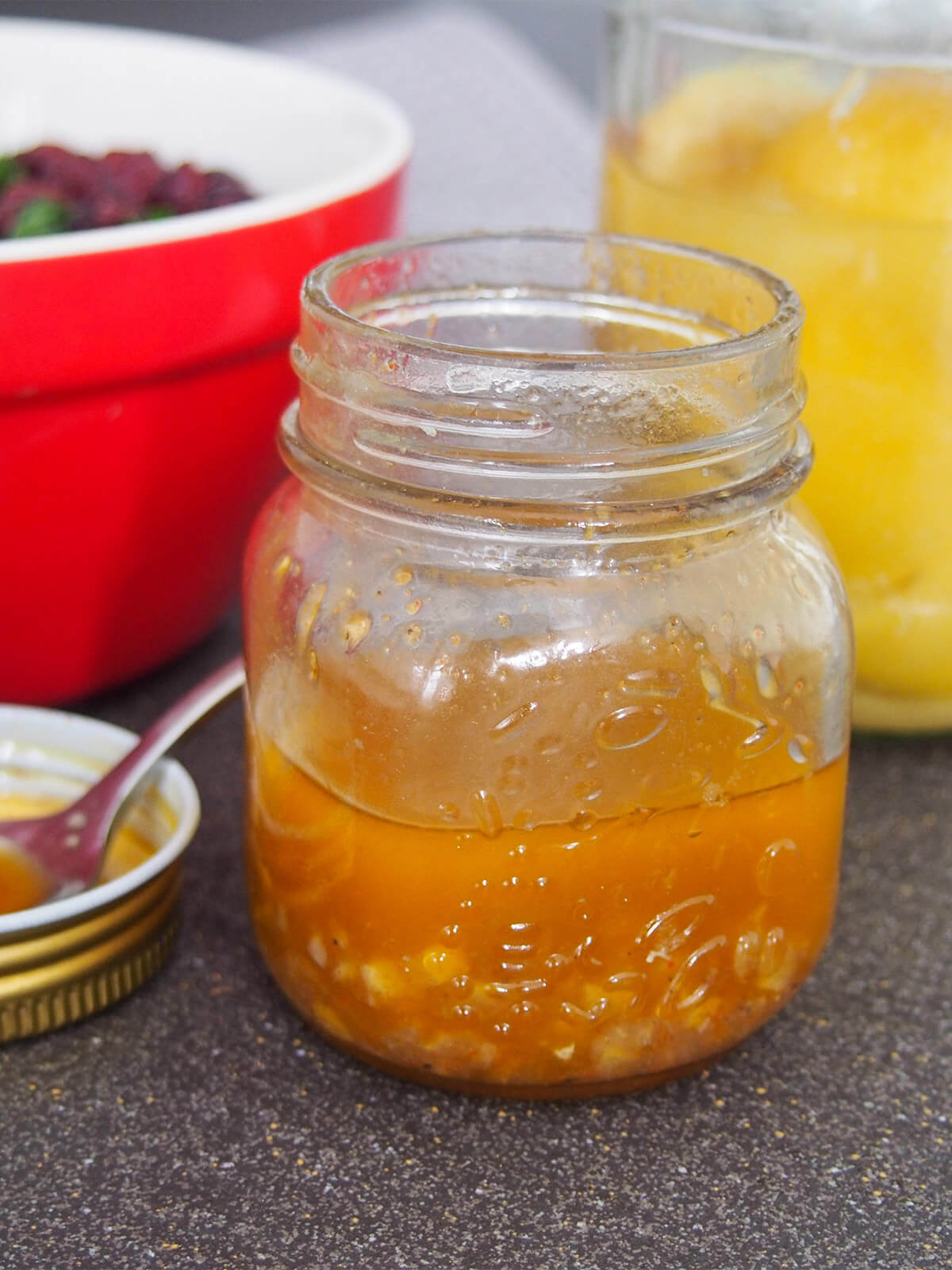 This preserved lemon vinaigrette/dressing is a delicious mix of tangy lemon and warm spice flavors. It works particularly well with crunchy autumnal/winter salads but would also be great mixed through couscous and more. Jar of preserved lemon vinaigrette
