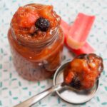 jar of rhubarb chutney with spoonful to side