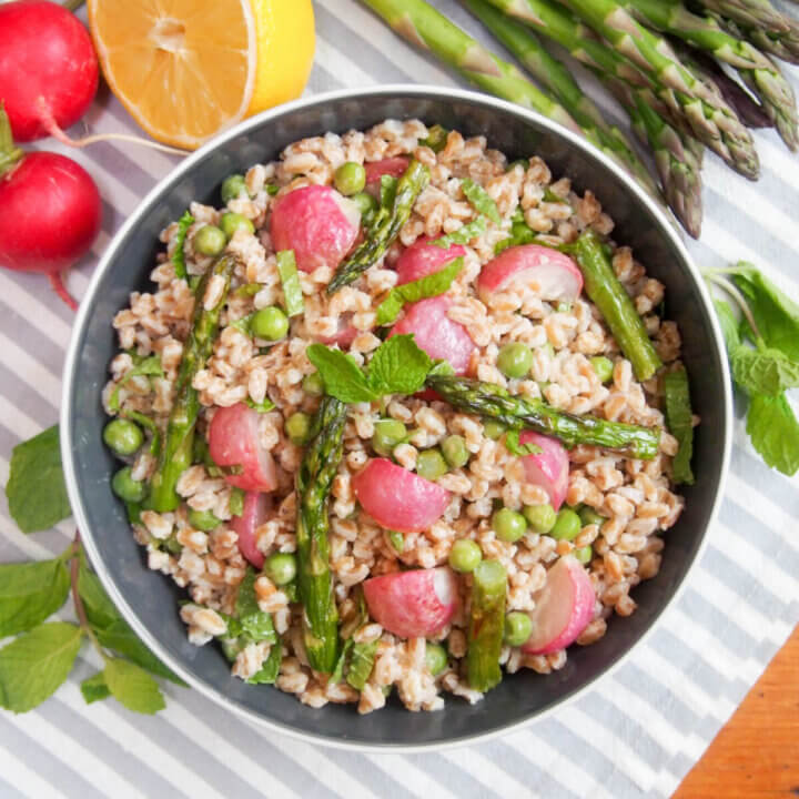 bowl of roasted spring vegetable farro salad from overhead