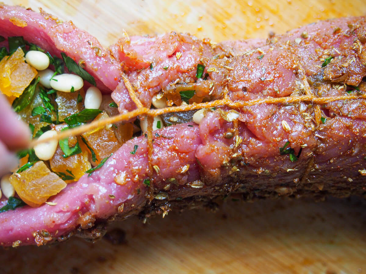 tying up stuffed pork