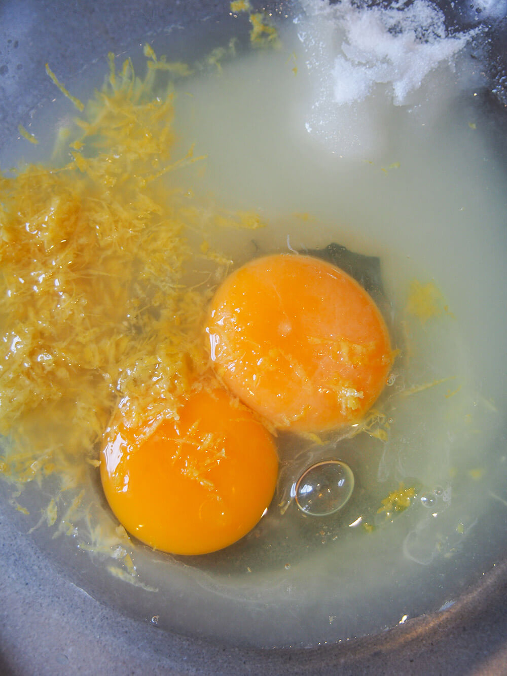 egg, sugar, lemon juice and zest in bowl