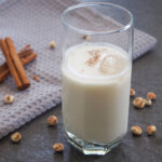 glass of Spanish horchata de chufa with tiger nuts to side