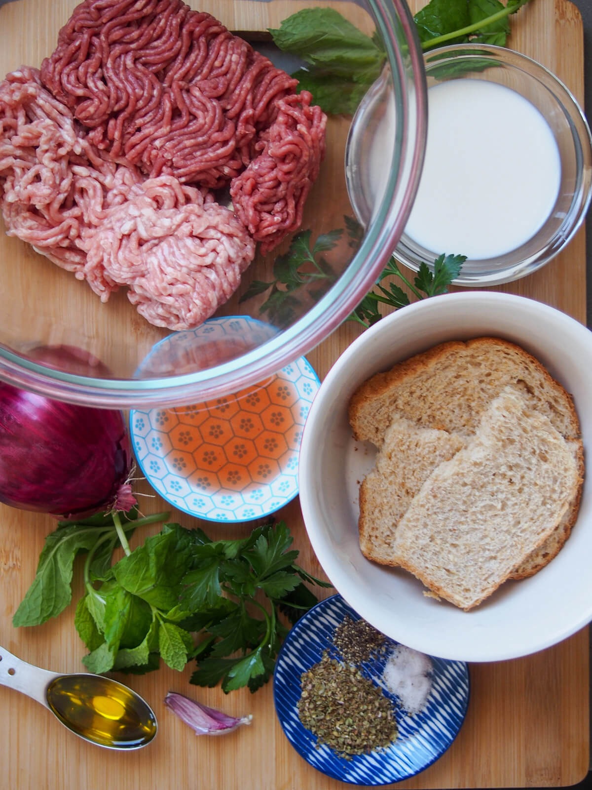 meats, bread, herbs, bread milk and other ingredients on board