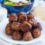 plate of keftedes Greek meatballs stacked up