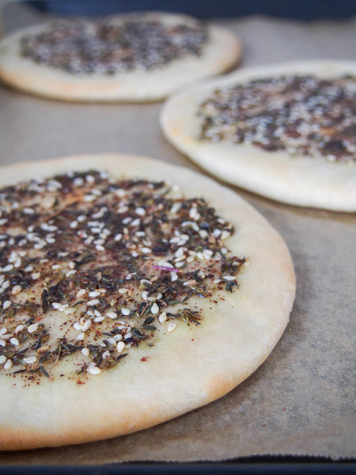 Manakish Lebanese za'atar flatbread on baking sheet out oven