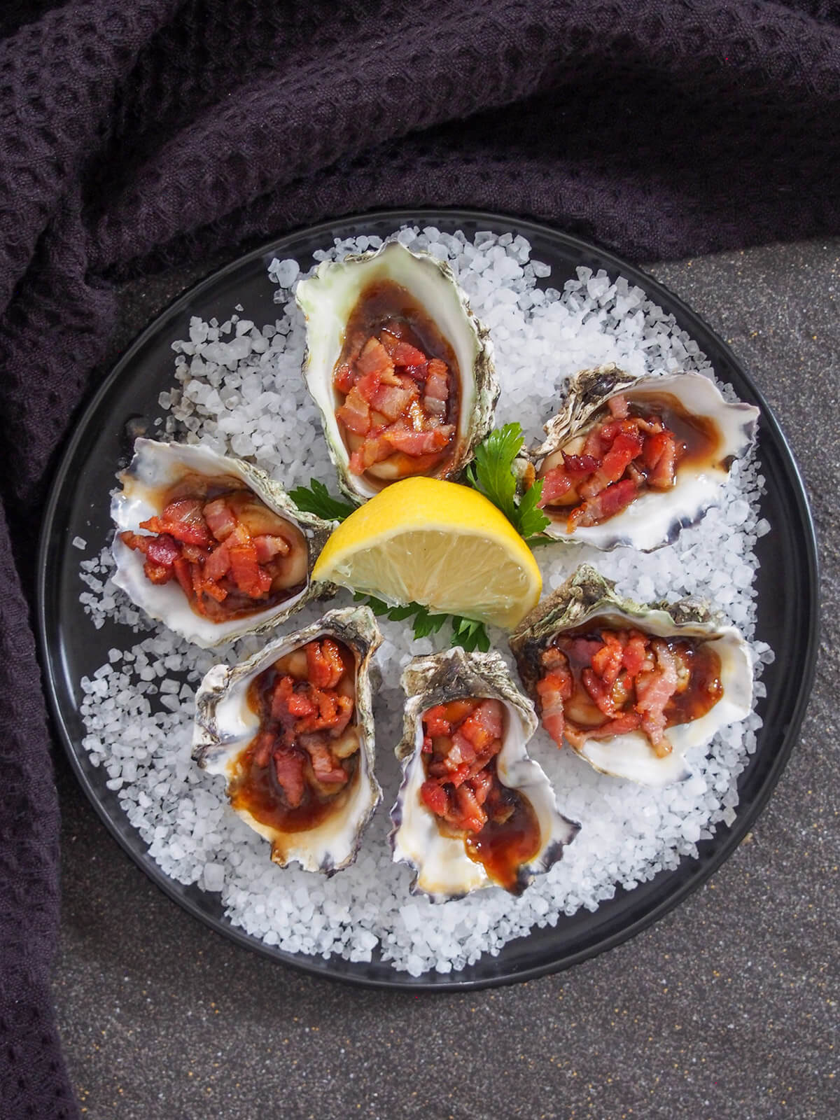 finished dish on a plate of rock salt from overhead