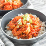 bowl of shrimp creole with another bowl behind