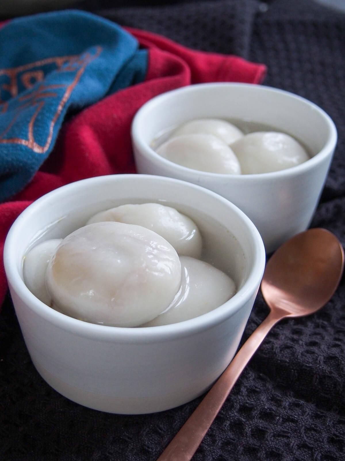 two bowls of Chinese sweet dumplings - tangyuan - in syrup