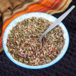 bowl of za'atar spice blend with spoon in it