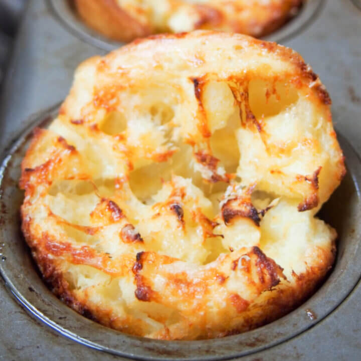 Apple and cheddar cheese Yorkshire pudding close up in muffin tin