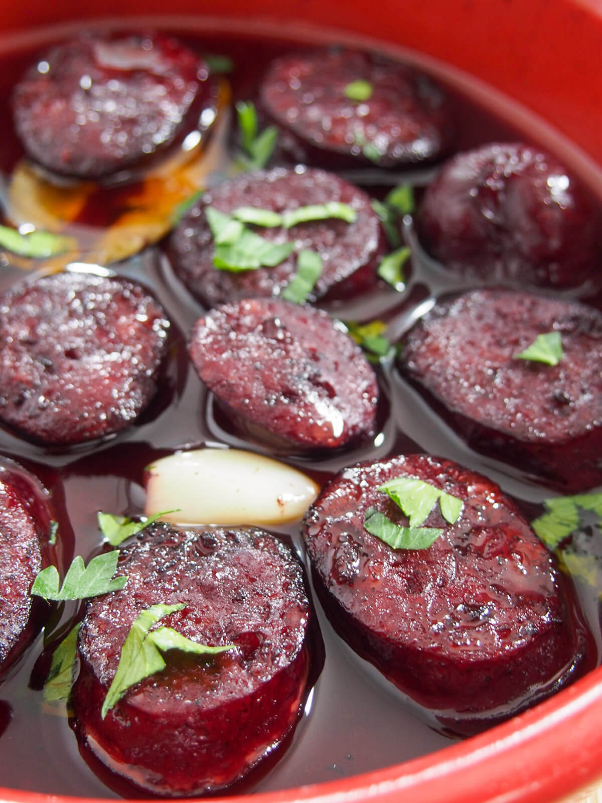 close up of slices of chorizo cooked in red wine