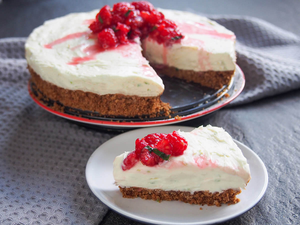 slice of lime mascarpone cheesecake in front of remaining cheesecake