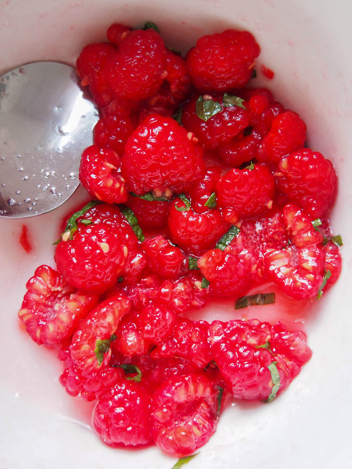 macerated raspberries in bowl