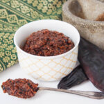 massaman curry paste in dish with spoonful in front