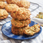 small plate with oatmeal pistachio cookies stacked