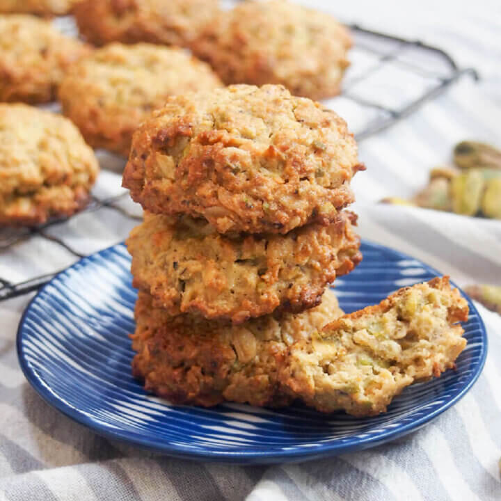 small plate with oatmeal pistachio cookies stacked