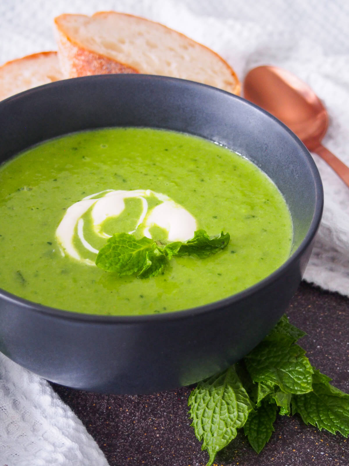 side view of bowl of pea and mint soup