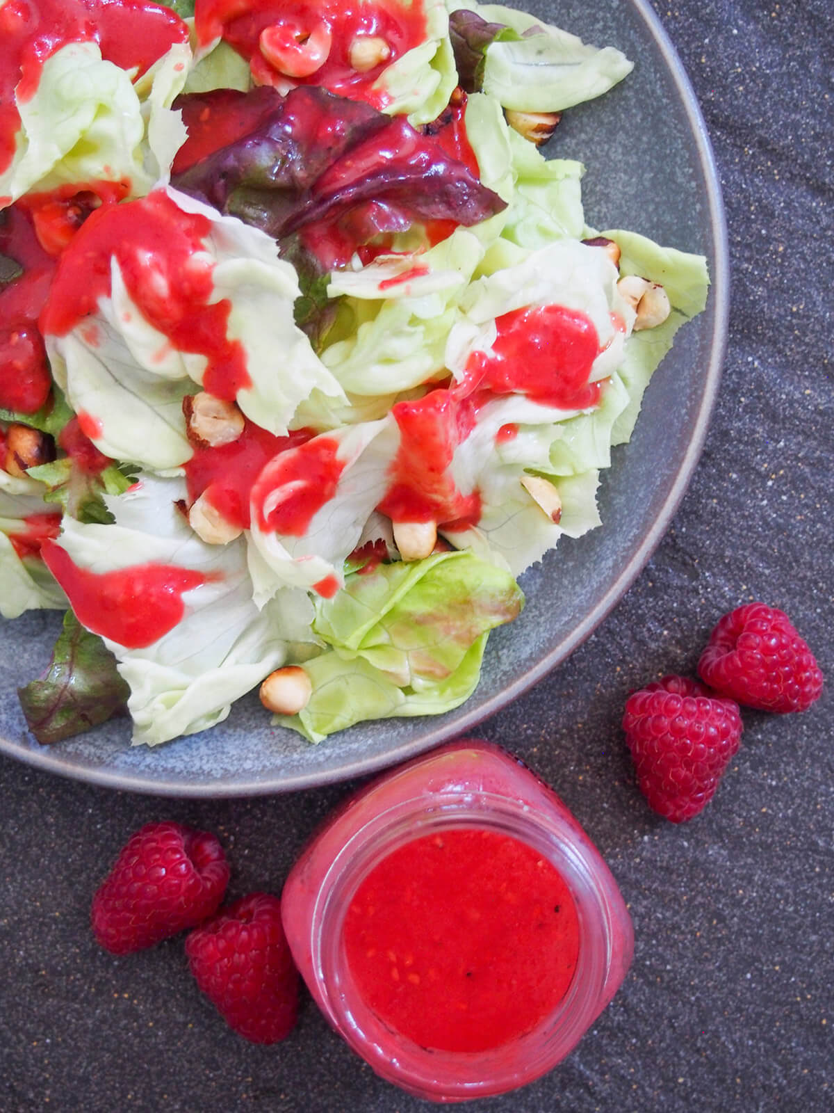 salad topped with dressing with jar with more below from overhead