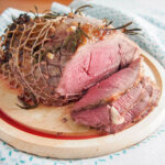 roast lamb with garlic and rosemary studded on top