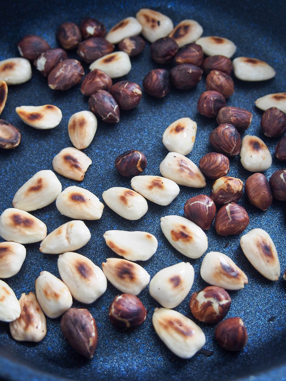 dry toasting hazelnuts and almonds in skillet