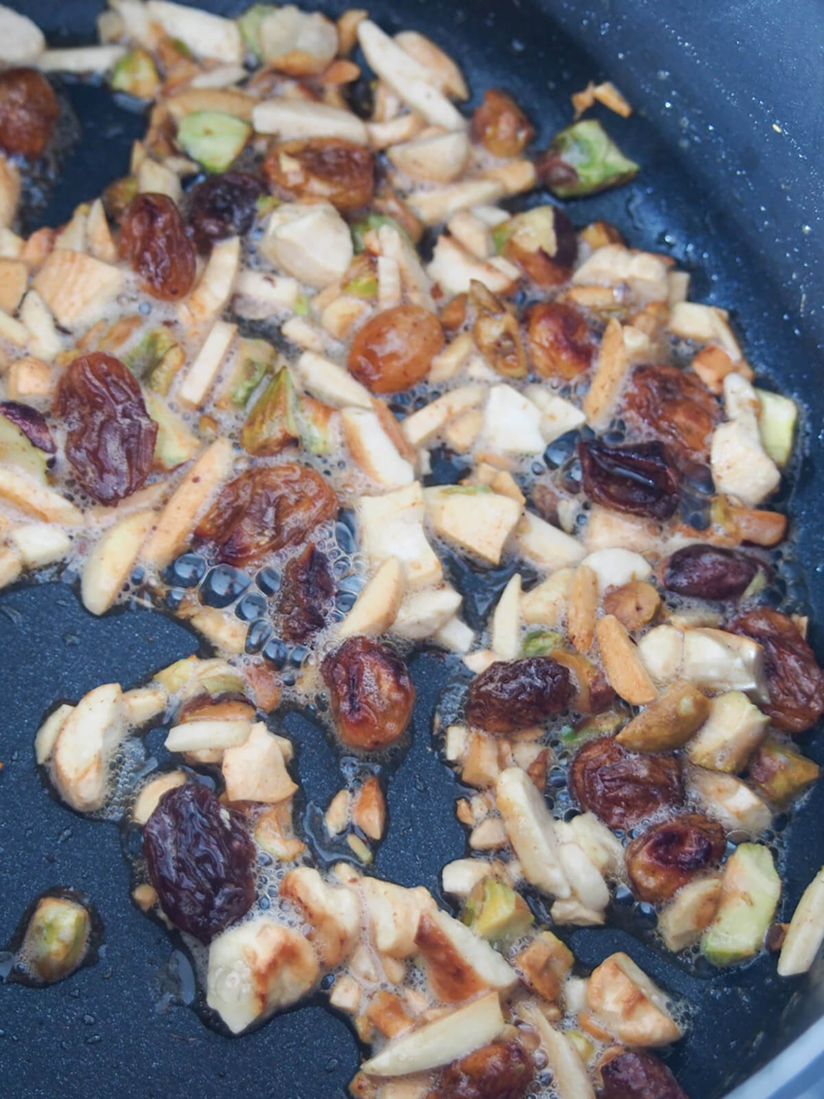 toasting nuts and dried fruit in skillet