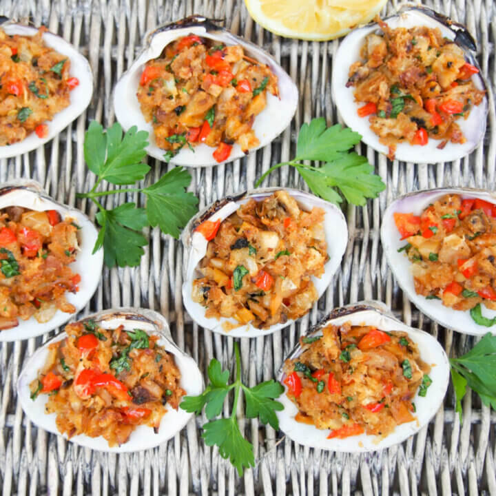 New England stuffed clams on basket with parsley between clams
