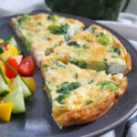 slices of broccoli goat cheese frittata on plate