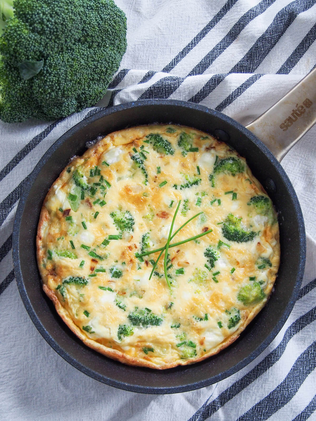 whole broccoli goat cheese frittata in skillet