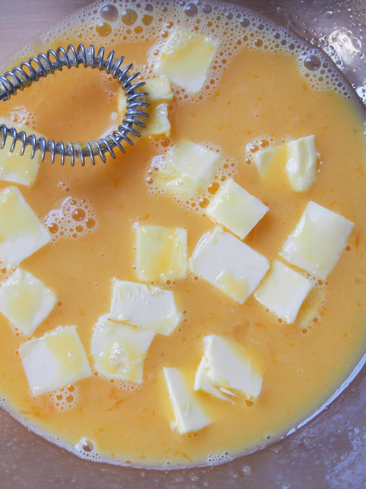 chunks of butter in egg-juice base