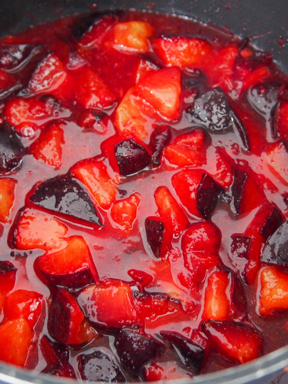 plums cooking down in pan