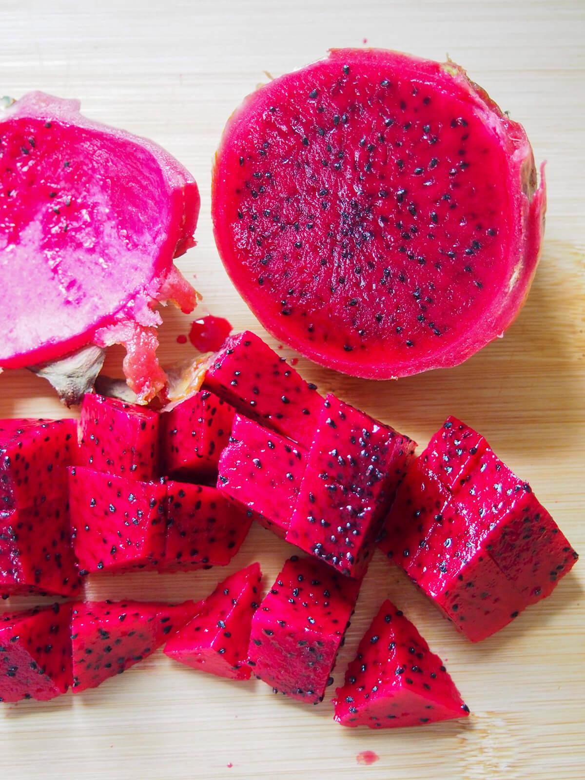 peeling and chopping red dragon fruit