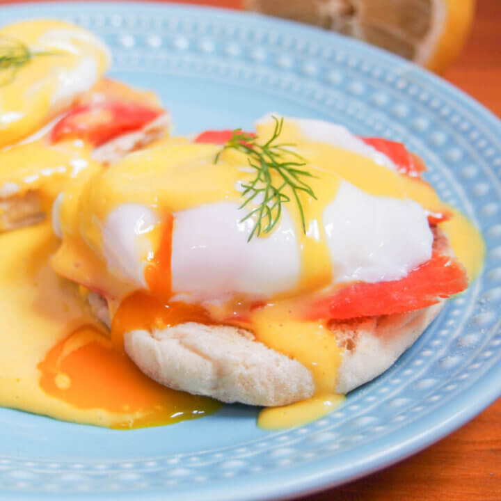 Eggs Royale (smoked salmon eggs Benedict) with yolk oozing into sauce