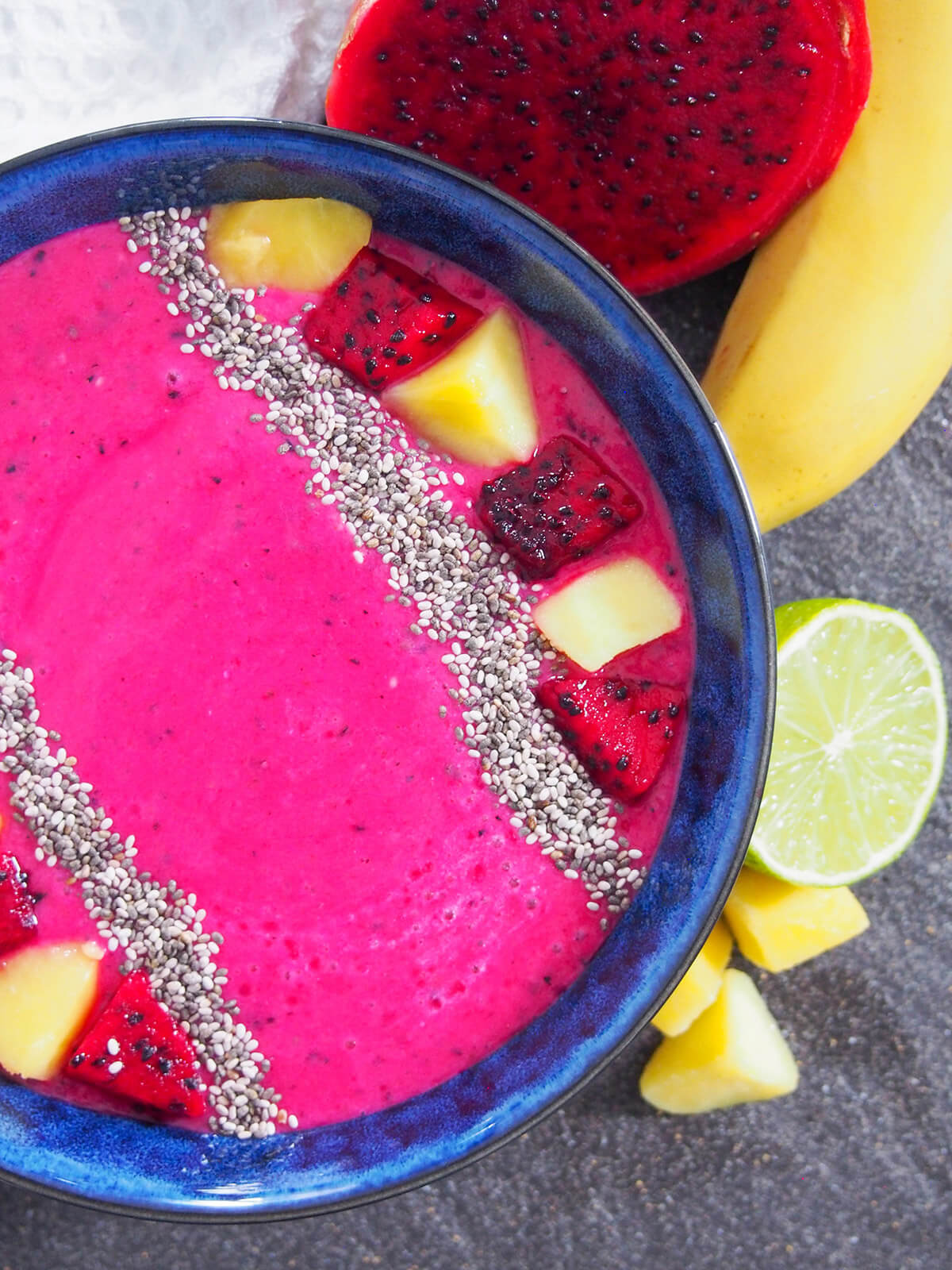 partial overhead view of mango dragon fruit smoothie