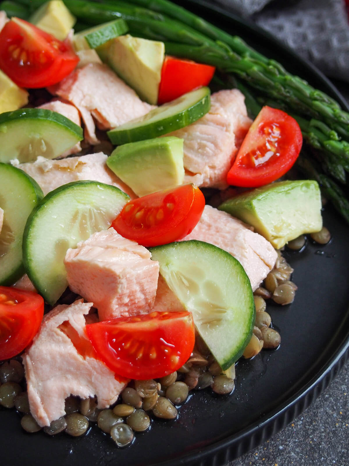 close up of plate of poached salmon salad