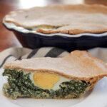 slice of torta pascualina in front of rest of tart