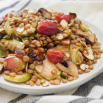 plate of vegan lentil salad with roasted Brussels sprouts