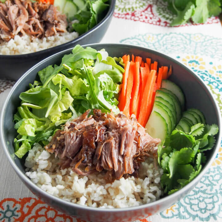 bowl with Vietnamese banh mi pork, rice and salad
