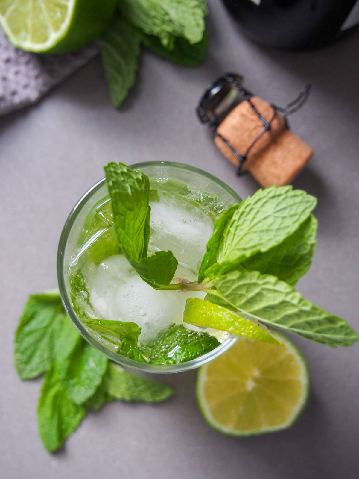 champagne mojito from overhead with champagne cork above glass