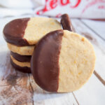 piece of chocolate orange shortbread resting against stack of more